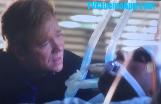 TVCinemaApp.com - CSI Miami: Horatio Caine (David Stephen Caruso) in hospital worried about Eric Delko (Adam Rodriguez) who has been shot by Calleigh Duquesne (Emily Procter).