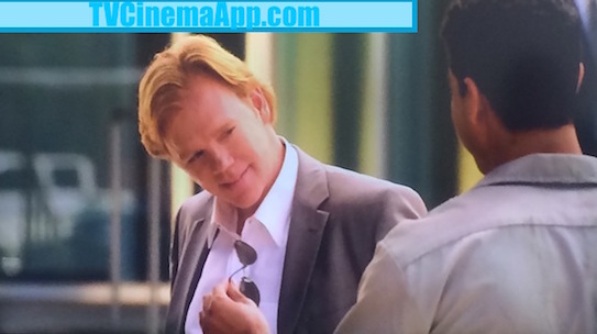 TVCinemaApp.com - CSI Miami: Eric Delko (Adam Rodriguez) with The Eyeglasses He Promised Horatio Caine (David Stephen Caruso) to Get for Him, as a gift.